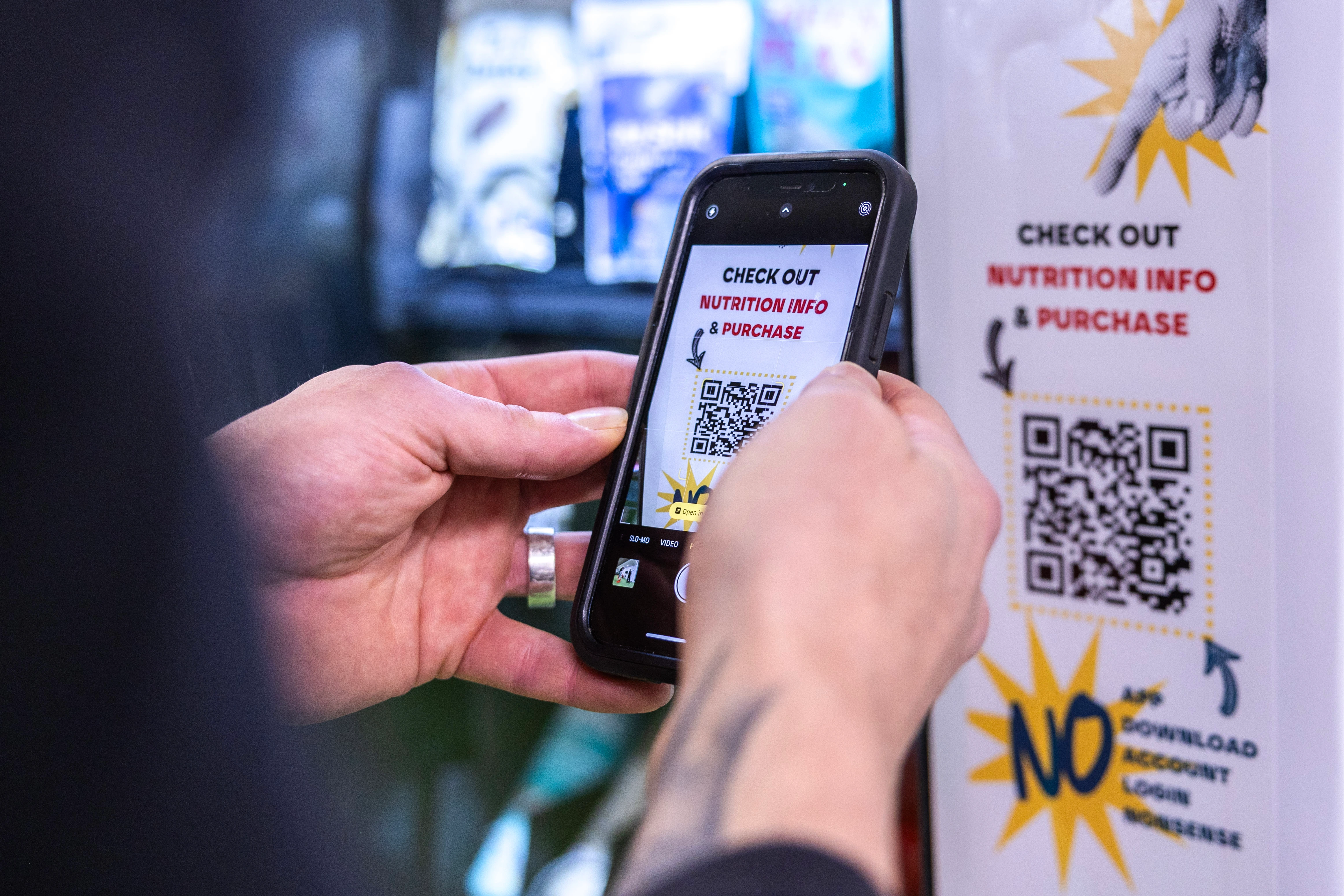 User scanning QR code on REALFAST machine